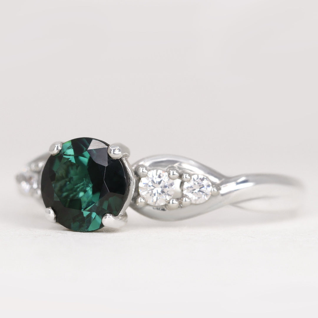Corinne - Round Brilliant Cut Teal Sapphire Five Stone Engagement Ring Engagement Rings - Price On Application