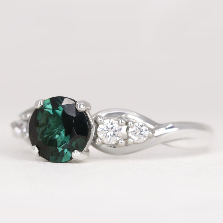 Corinne - Round Brilliant Cut Teal Sapphire Five Stone Engagement Ring Engagement Rings - Price On Application