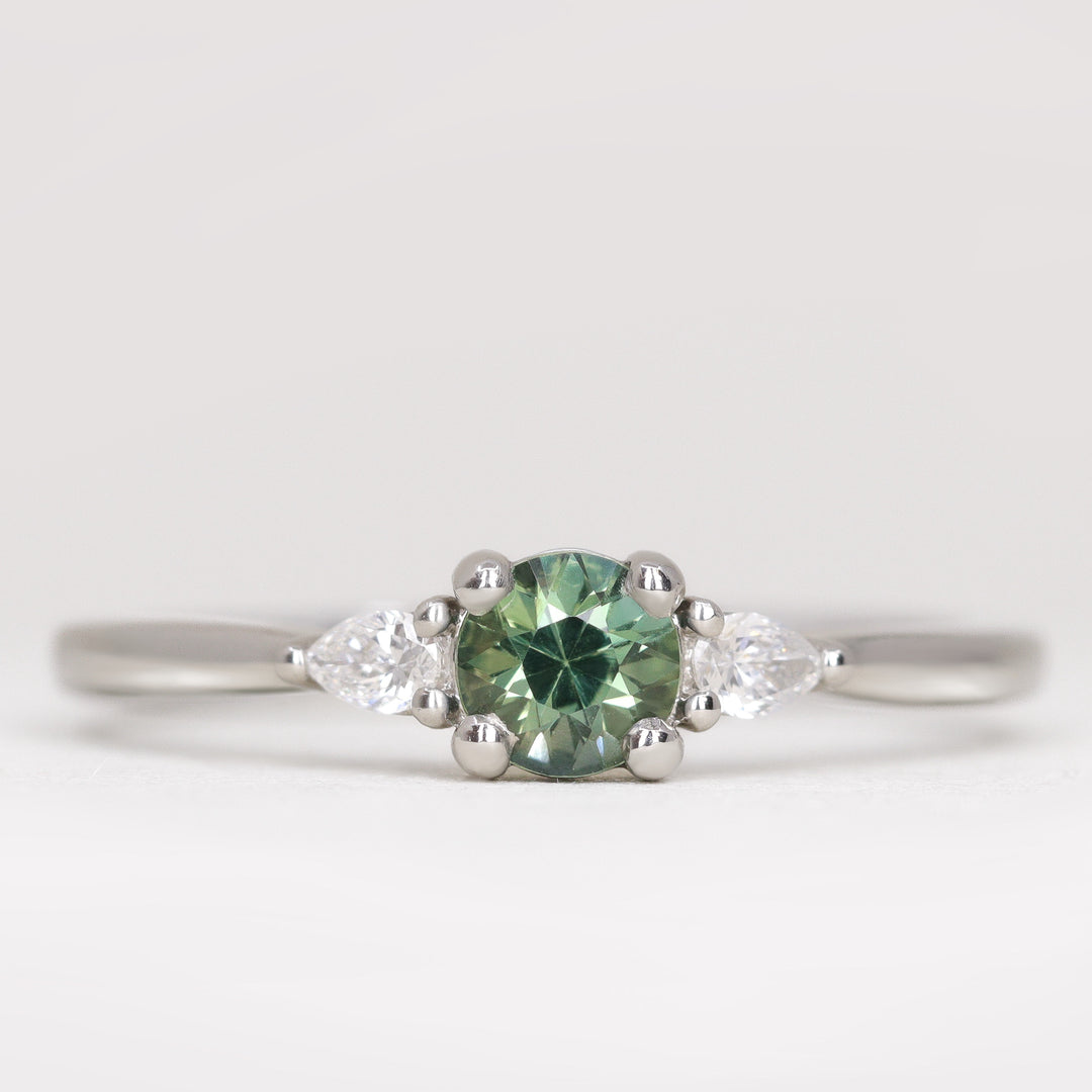 Elspeth - Round Brilliant Cut Teal Sapphire Trilogy Engagement Ring Engagement Rings - Made-to-Order