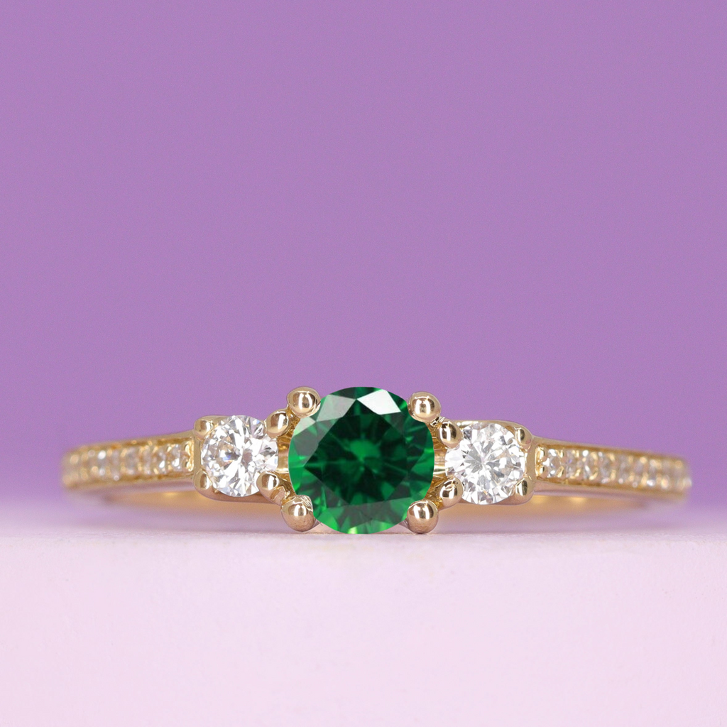 Callie - Round Brilliant Cut Emerald Trilogy Engagement Ring