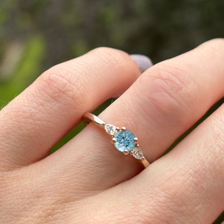 Aquamarine and lab grown diamond engagement ring in rose gold