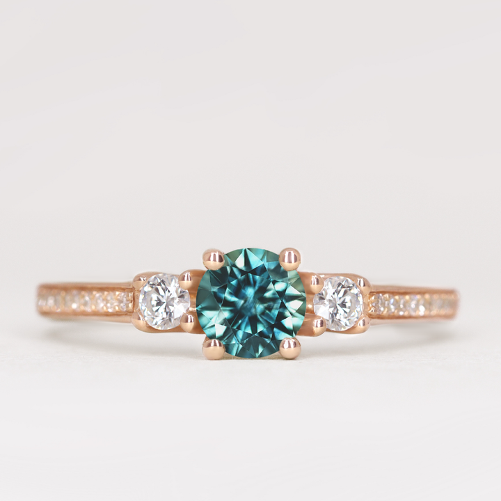Callie - Round Brilliant Cut Teal Sapphire Delicate Trilogy Engagement Ring