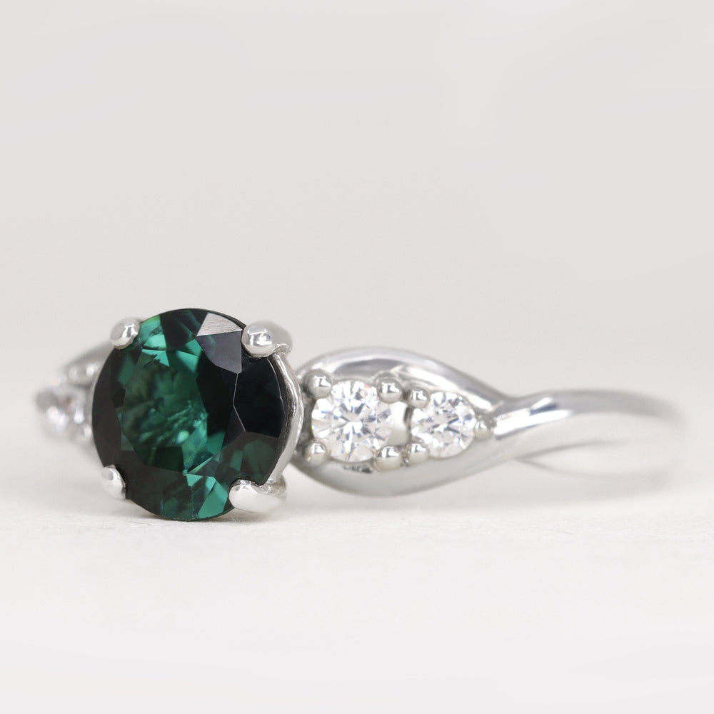 Corinne - Round Brilliant Cut Teal Sapphire Five Stone Engagement Ring Engagement Rings - Price On Application