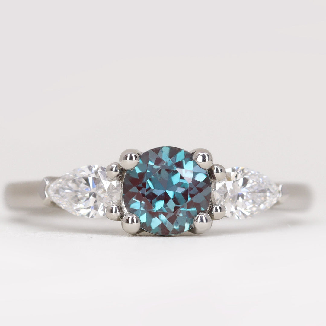 Round cut alexandrite and lab diamond engagement ring