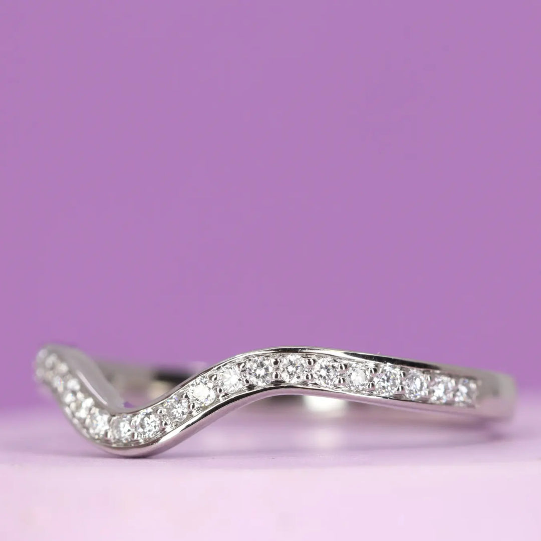 Bespoke shaped wedding ring with diamonds