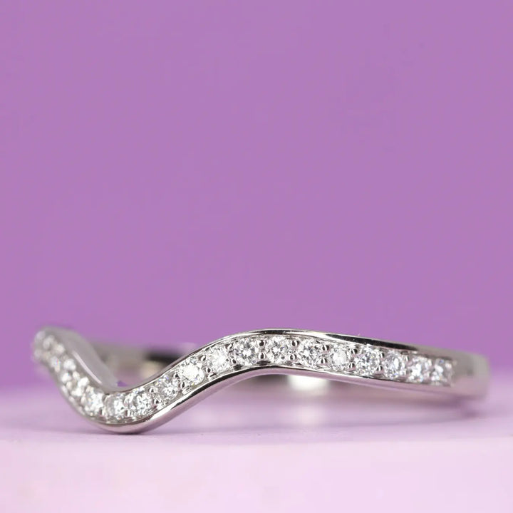 Bespoke shaped wedding ring with diamonds