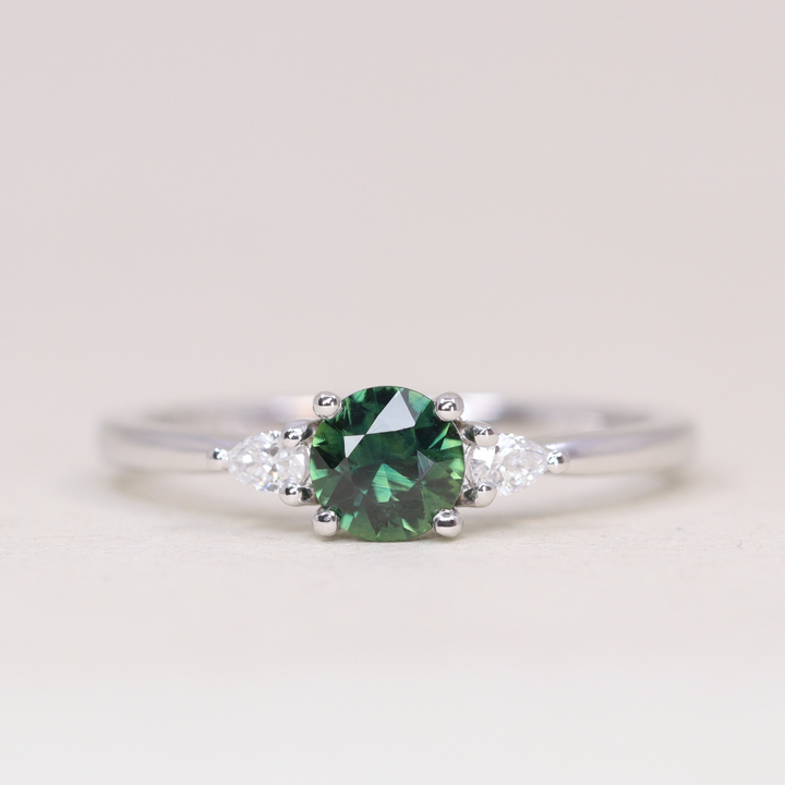 Elspeth - Round Cut Green Teal Sapphire Trilogy Engagement Ring - Ready-to-Wear Engagement Rings - Ready-to-Ship
