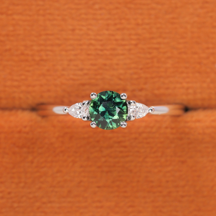 Elspeth - Round Cut Green Teal Sapphire Trilogy Engagement Ring - Ready-to-Wear Engagement Rings - Ready-to-Ship