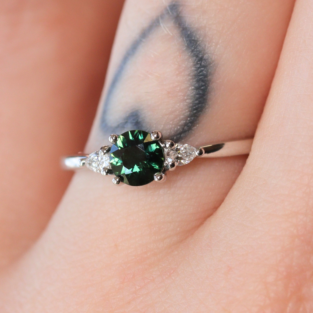 Elspeth - Round Cut Colour Change Teal Sapphire Trilogy Engagement Ring - Ready-to-Wear