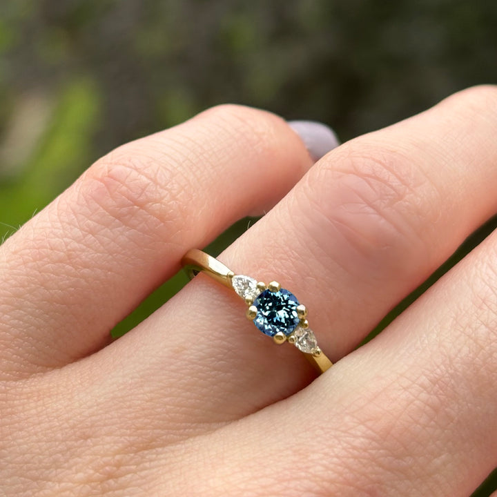 Unique alexandrite engagement ring with lab grown diamonds in yellow gold