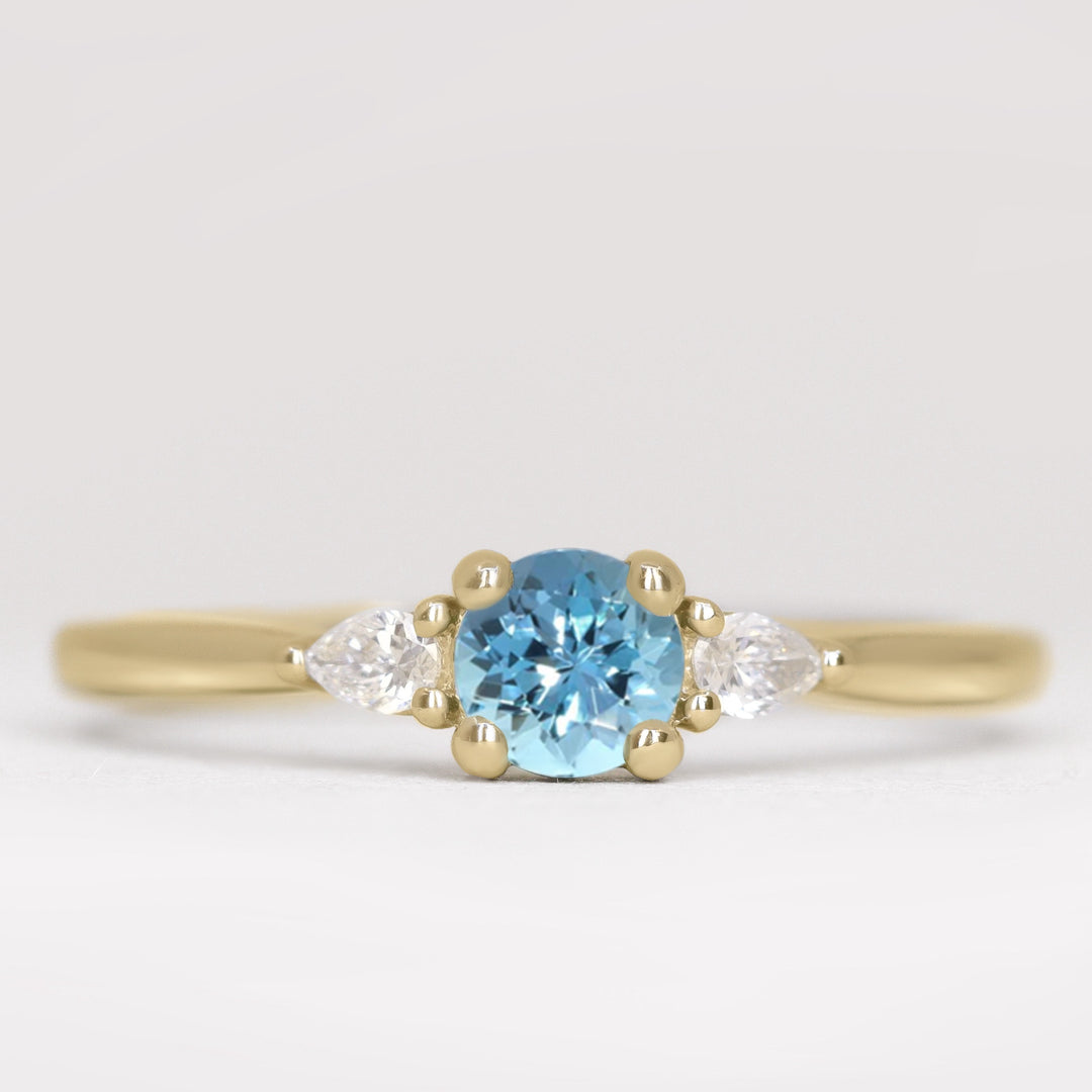 Aquamarine and lab grown diamond yellow gold engagement ring