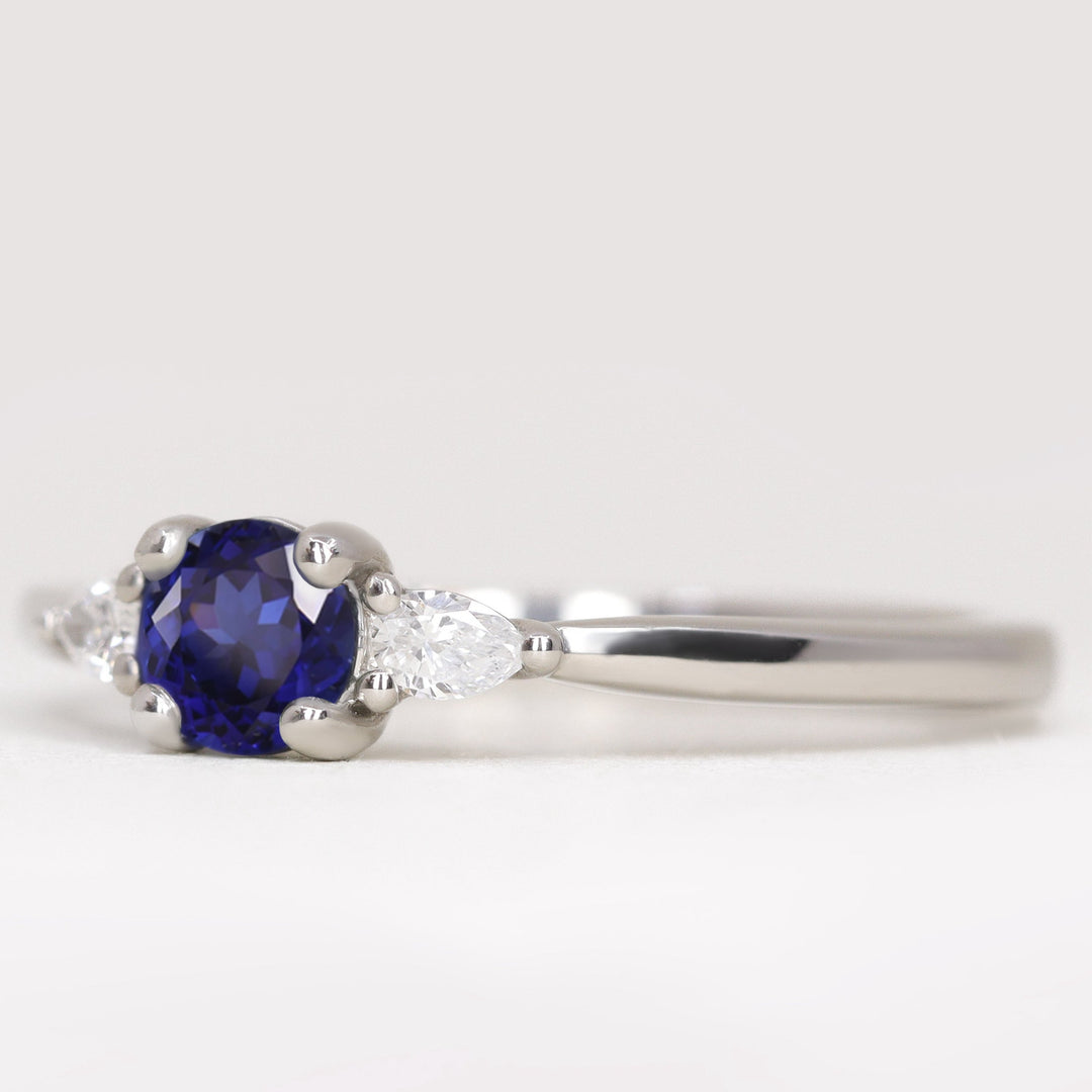 Unique round blue sapphire and lab grown diamond engagement ring