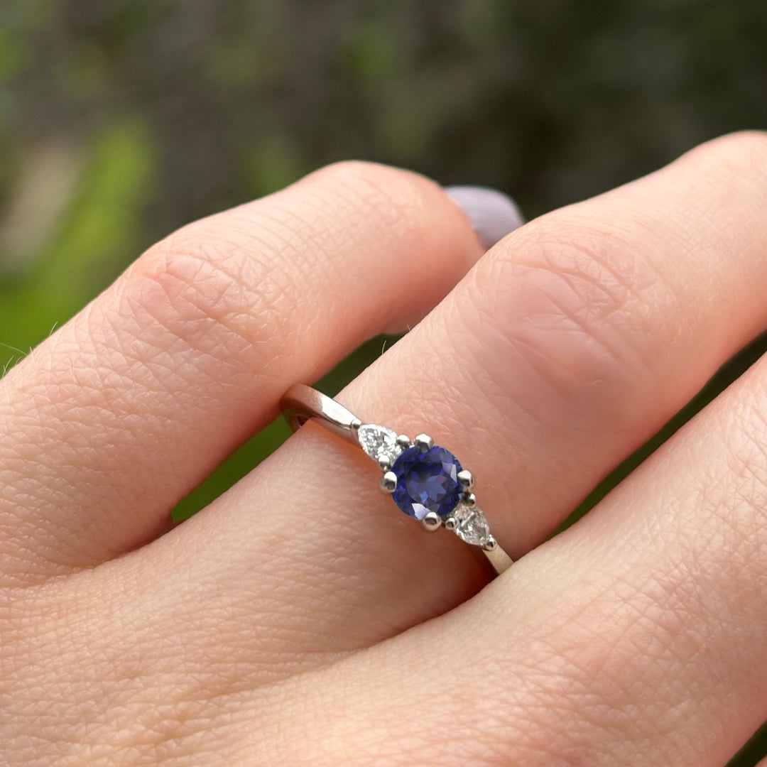 Unique round blue sapphire and lab grown diamond engagement ring