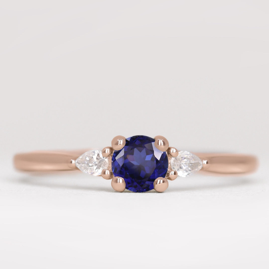 Unique round blue sapphire and lab grown diamond rose gold engagement ring