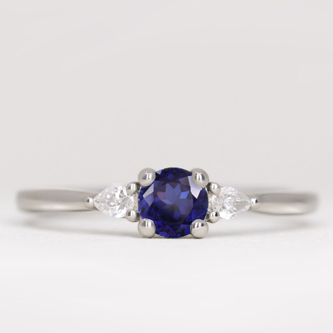 Unique round blue sapphire and lab grown diamond engagement ring