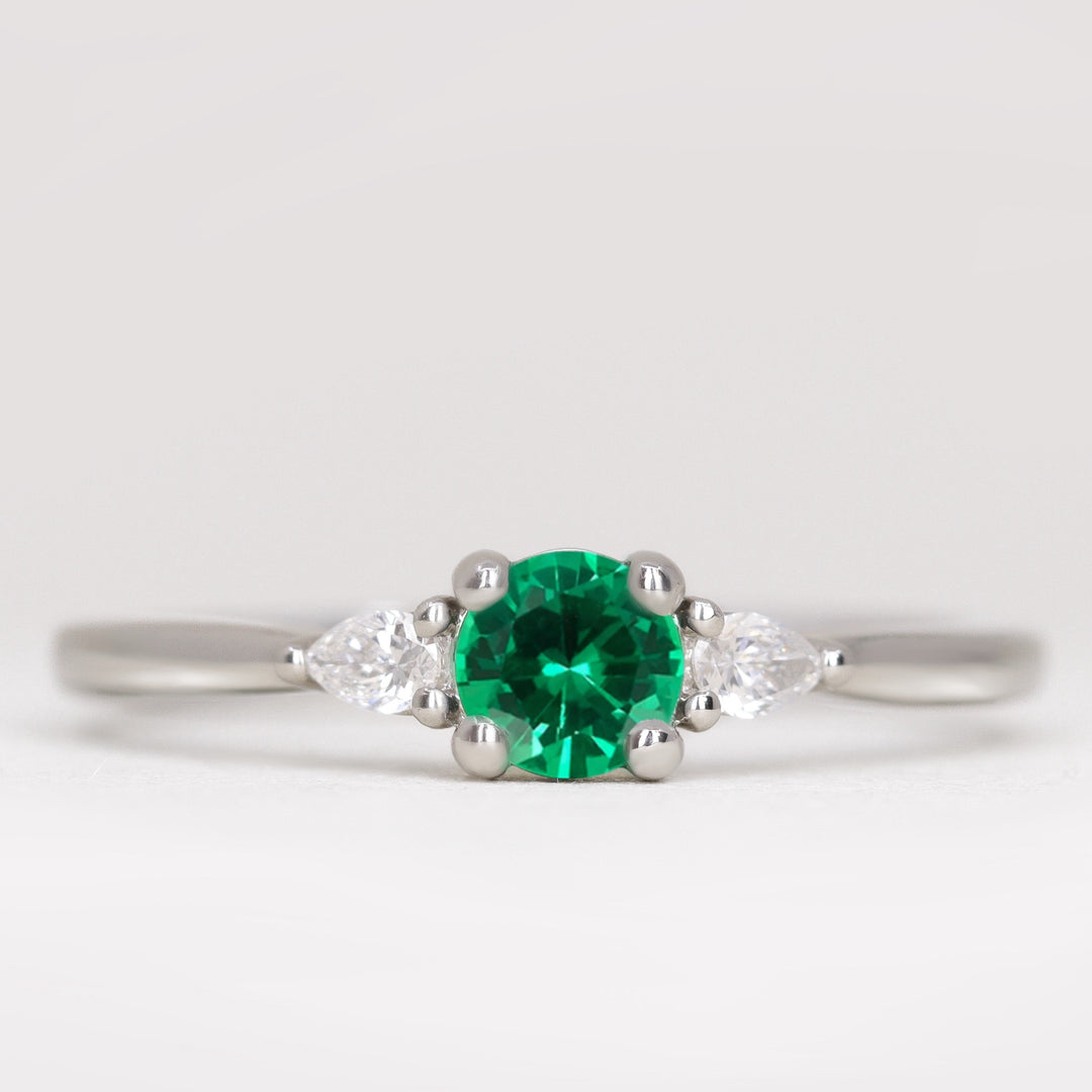 Unique round emerald and lab grown diamond engagement ring platinum