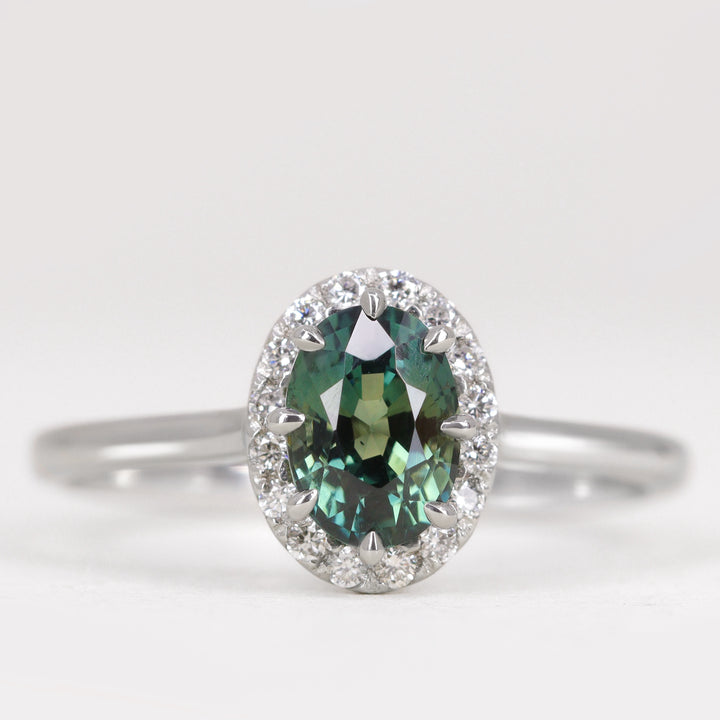 Charlotte - Oval Cut Green Teal Sapphire Hugging Halo Engagement Ring