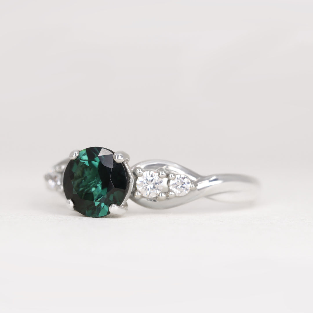 Corinne - Round Brilliant Cut Teal Sapphire Five Stone Engagement Ring