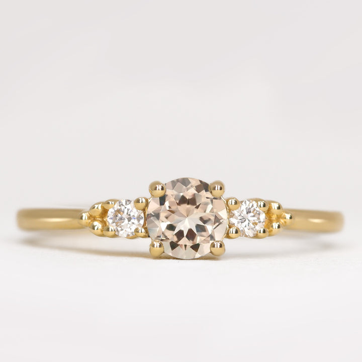 Natalia - Round Cut Morganite and Diamond Trilogy Engagement Ring