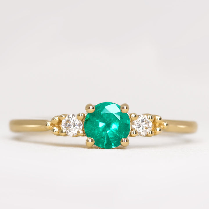 Natalia - Round Cut Emerald and Diamond Trilogy Engagement Ring