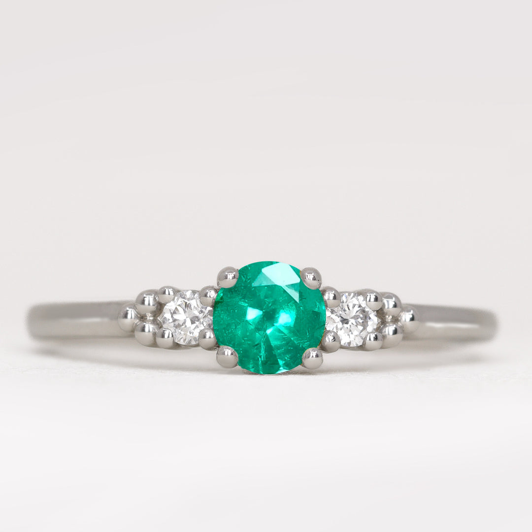 Natalia - Round Cut Emerald and Diamond Trilogy Engagement Ring