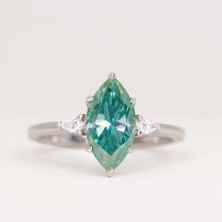 Elspeth - Marquise Cut Teal Moissanite and Diamond Trilogy Engagement Ring