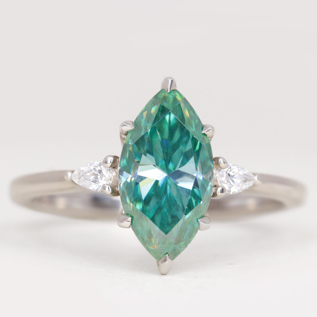 Elspeth - Marquise Cut Teal Moissanite and Diamond Trilogy Engagement Ring