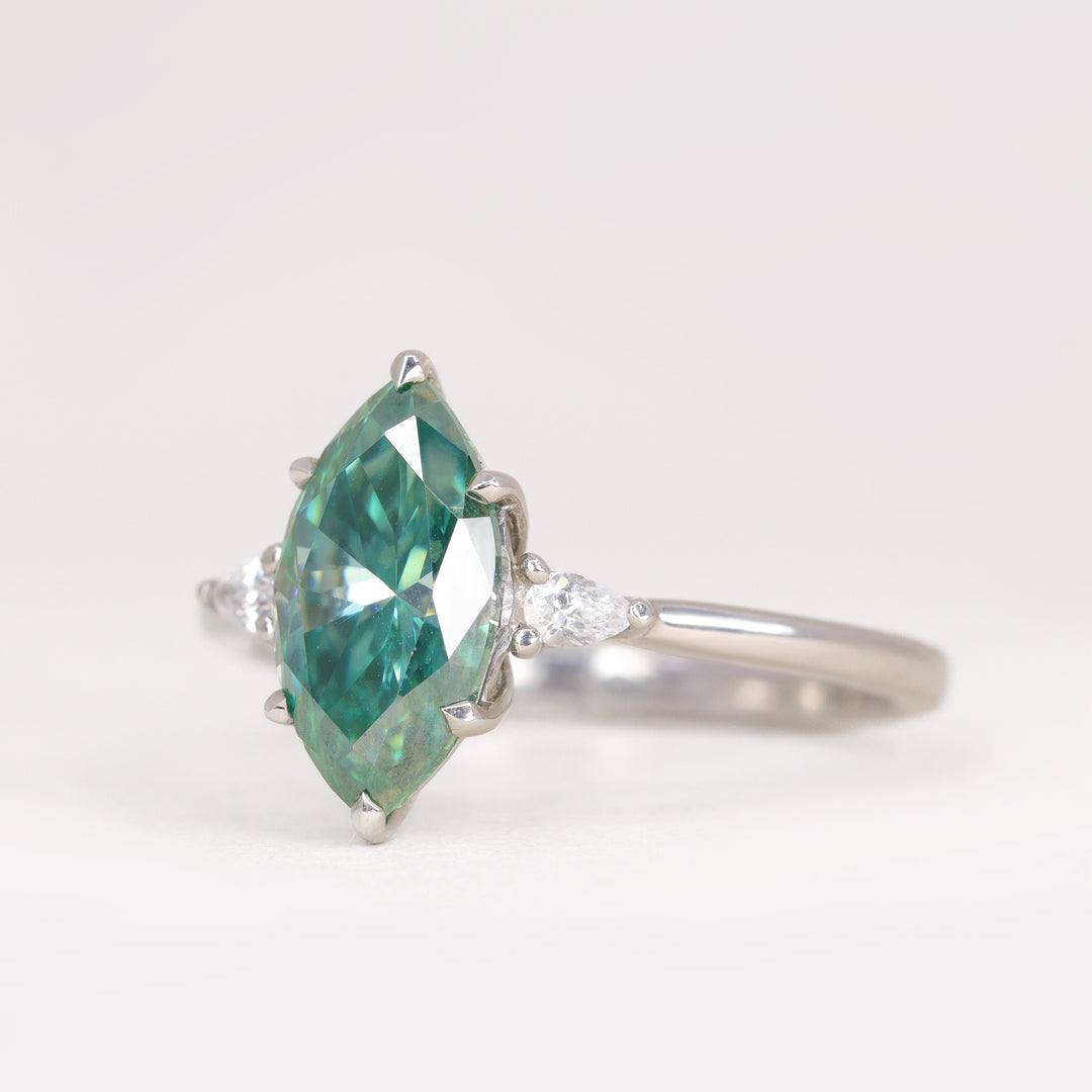 Elspeth - Marquise Cut Teal Moissanite and Diamond Trilogy Engagement Ring