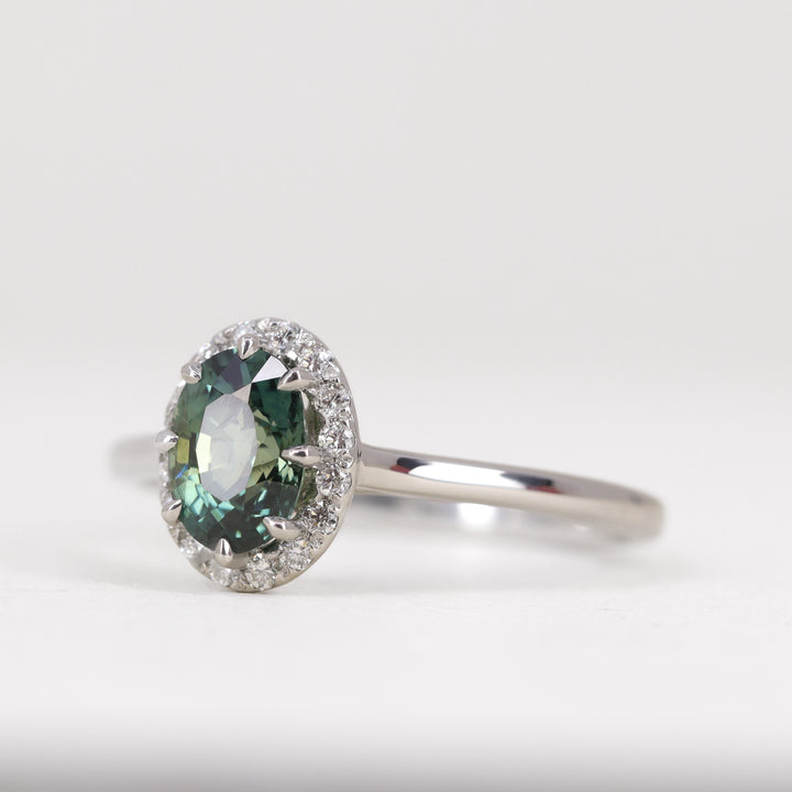 Charlotte - Oval Cut Teal Sapphire Hugging Halo Engagement Ring - Ready-to-Wear