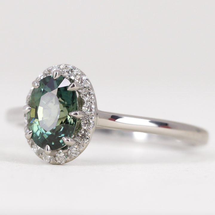 Charlotte - Oval Cut Green Teal Sapphire Hugging Halo Engagement Ring