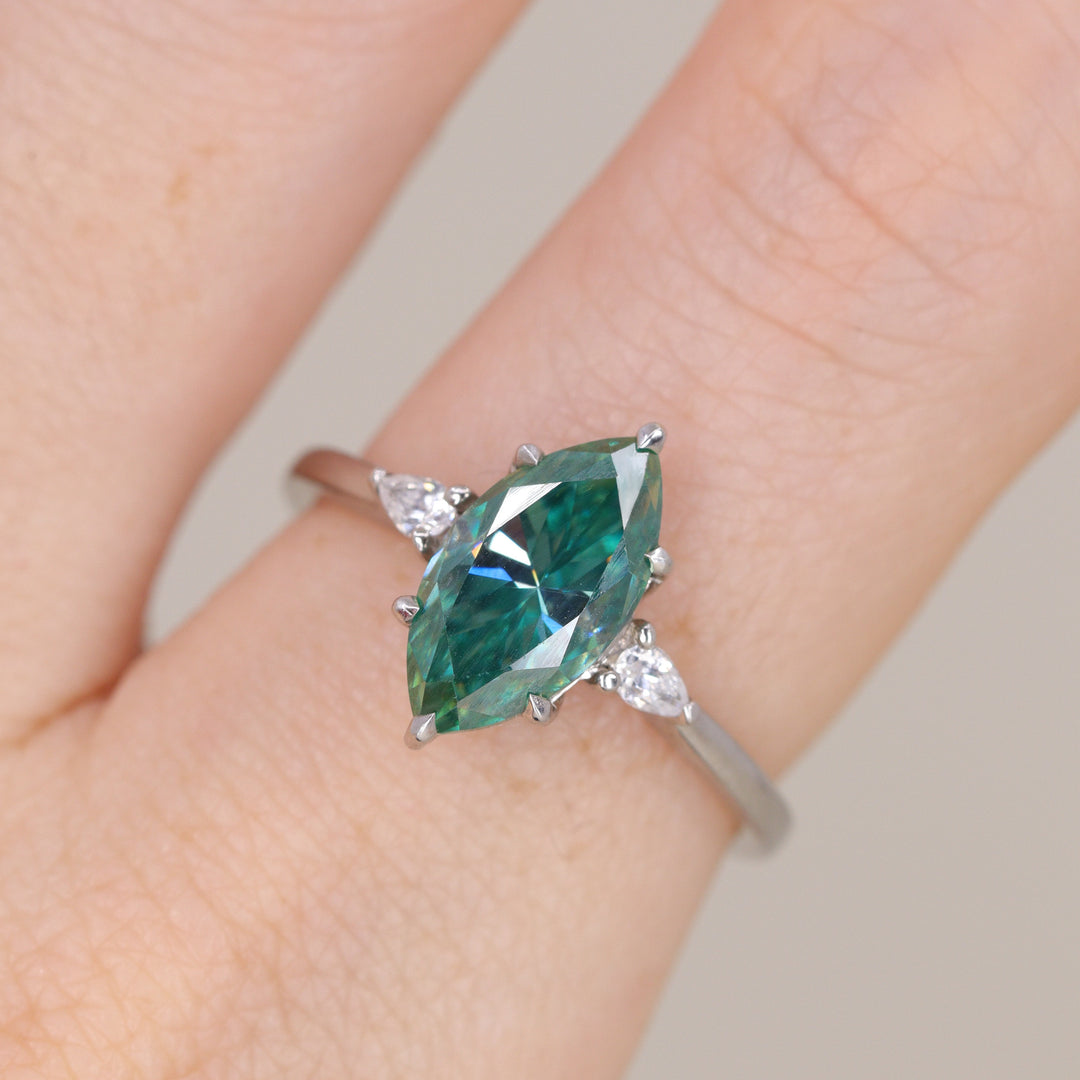 Elspeth - Marquise Cut Teal Moissanite and Diamond Trilogy Engagement Ring