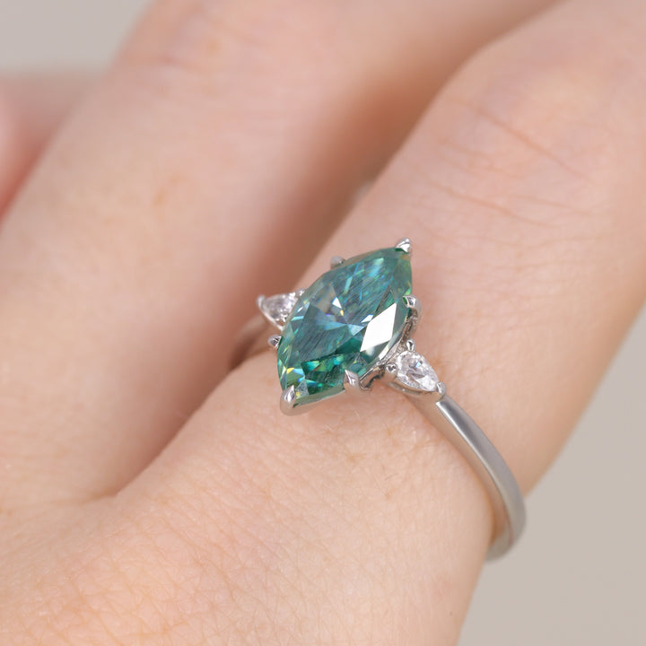 Elspeth - Marquise Cut Teal Moissanite and Diamond Trilogy Engagement Ring