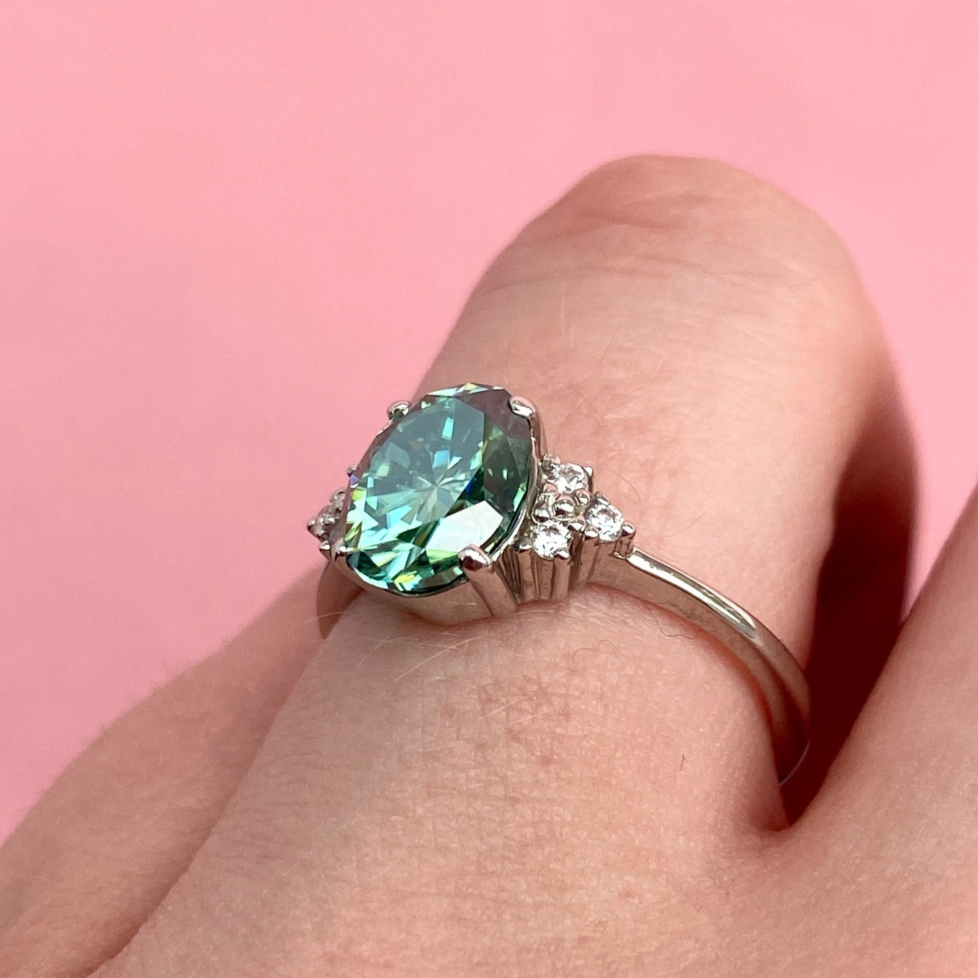 Henrietta - Oval Cut Teal Moissanite Ring with Round Brilliant Cut Diamond Side Stones - Custom Made-to-Order Design