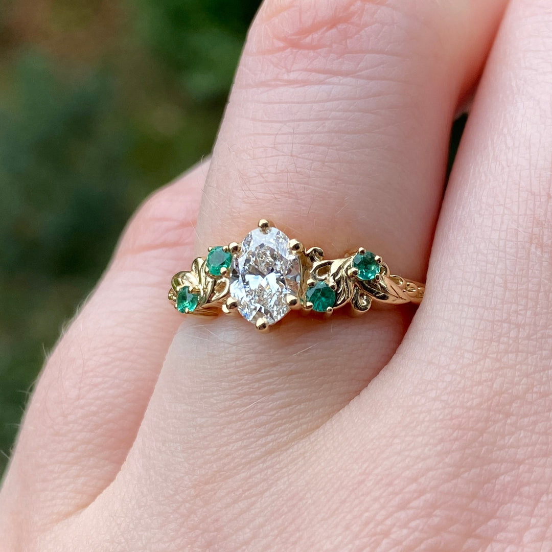 Laurel - The Botanicals Collection - Oval Lab Grown Diamond and Emerald Decorative Leaf/Vine Filigree Art Nouveau Engagement Ring in 14ct Yellow Gold - Ready-To-Wear