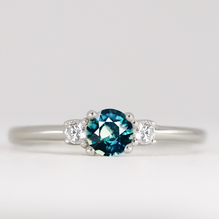 Millie - Round Brilliant Cut Teal Sapphire and Diamond Trilogy Engagement Ring