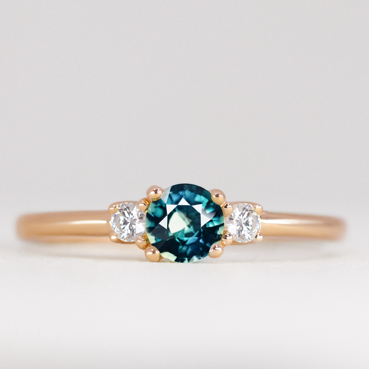 Millie - Round Brilliant Cut Teal Sapphire and Diamond Trilogy Engagement Ring