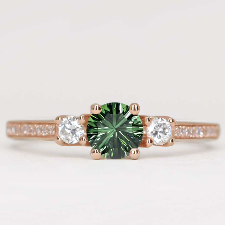 Round cut tourmaline and diamond trilogy engagement ring with white diamond pave band