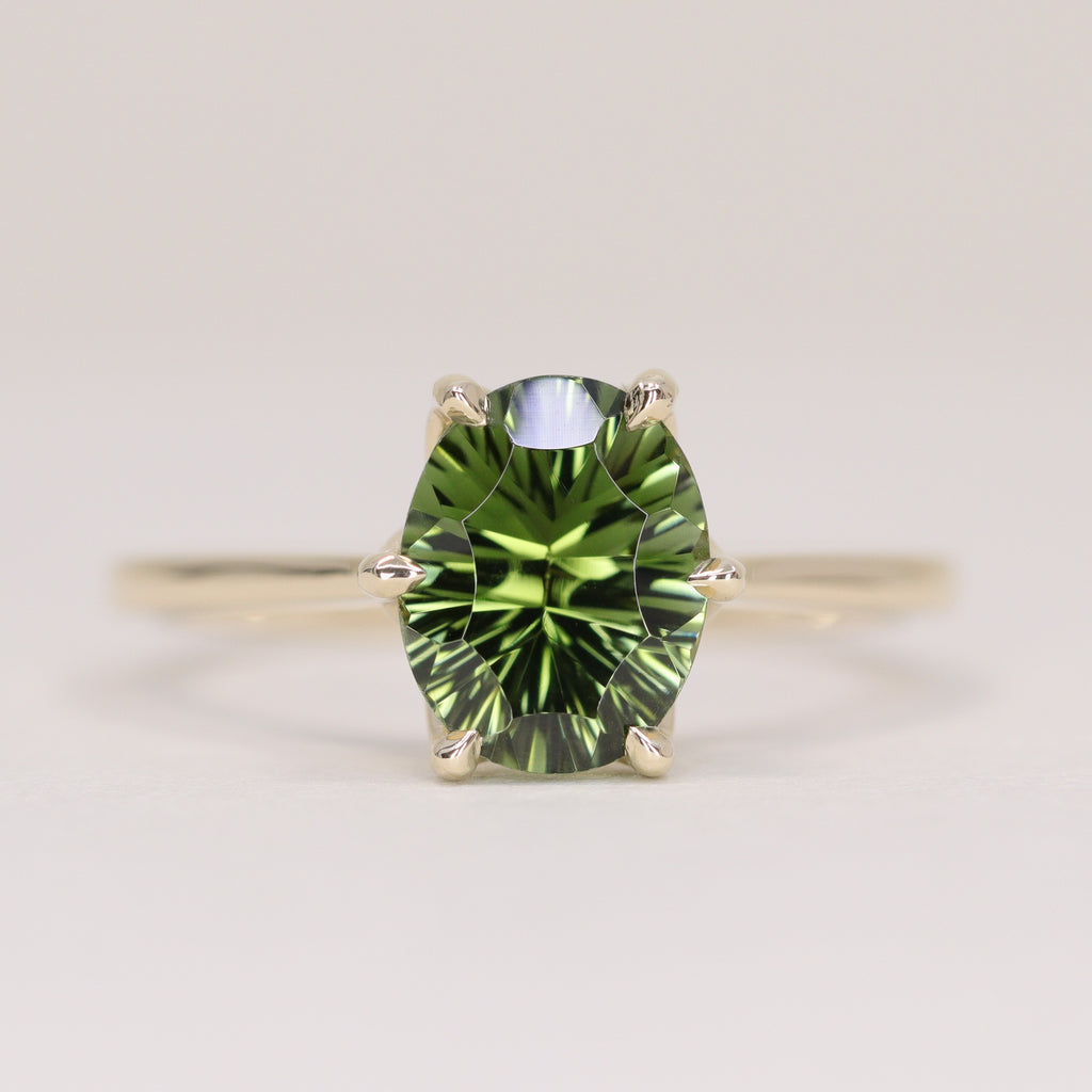 Raine - Oval Cut Teal Sapphire Solitaire Ring with Lotus Flower