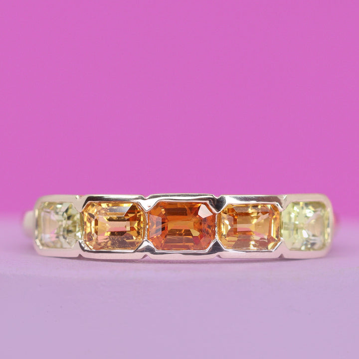 Clementine - Emerald Cut Orange and Yellow Sapphire 5 Stone Half Rubover Eternity Style Ring in 9ct Yellow Gold - Ready-to-Wear