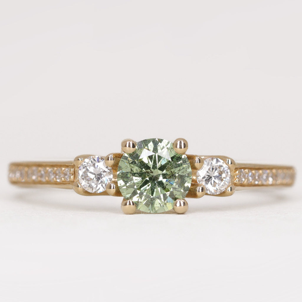 Round green diamond and white diamond pave  yellow gold band engagement ring