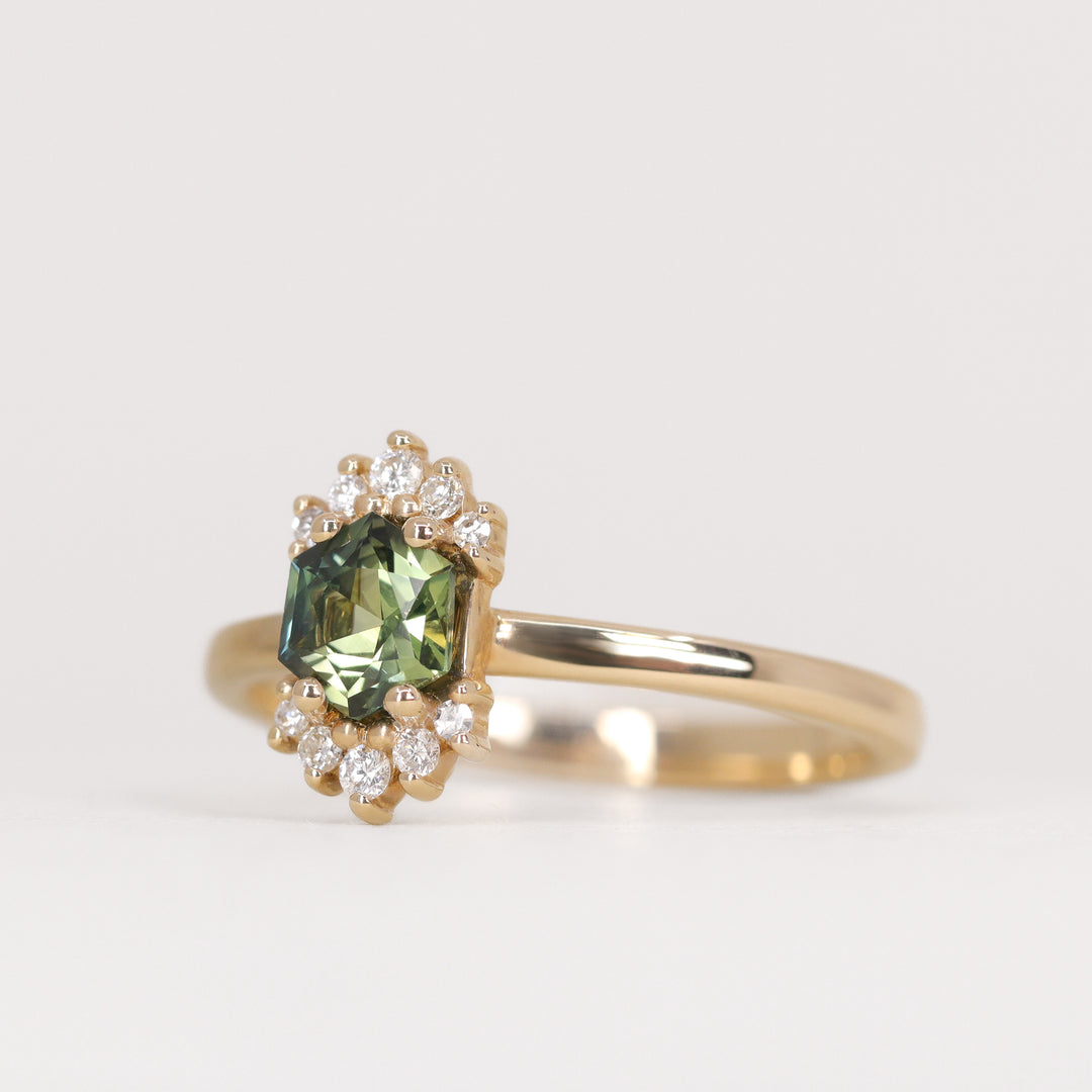 Unique hexagon cut green sapphire yellow gold engagement ring with white diamonds