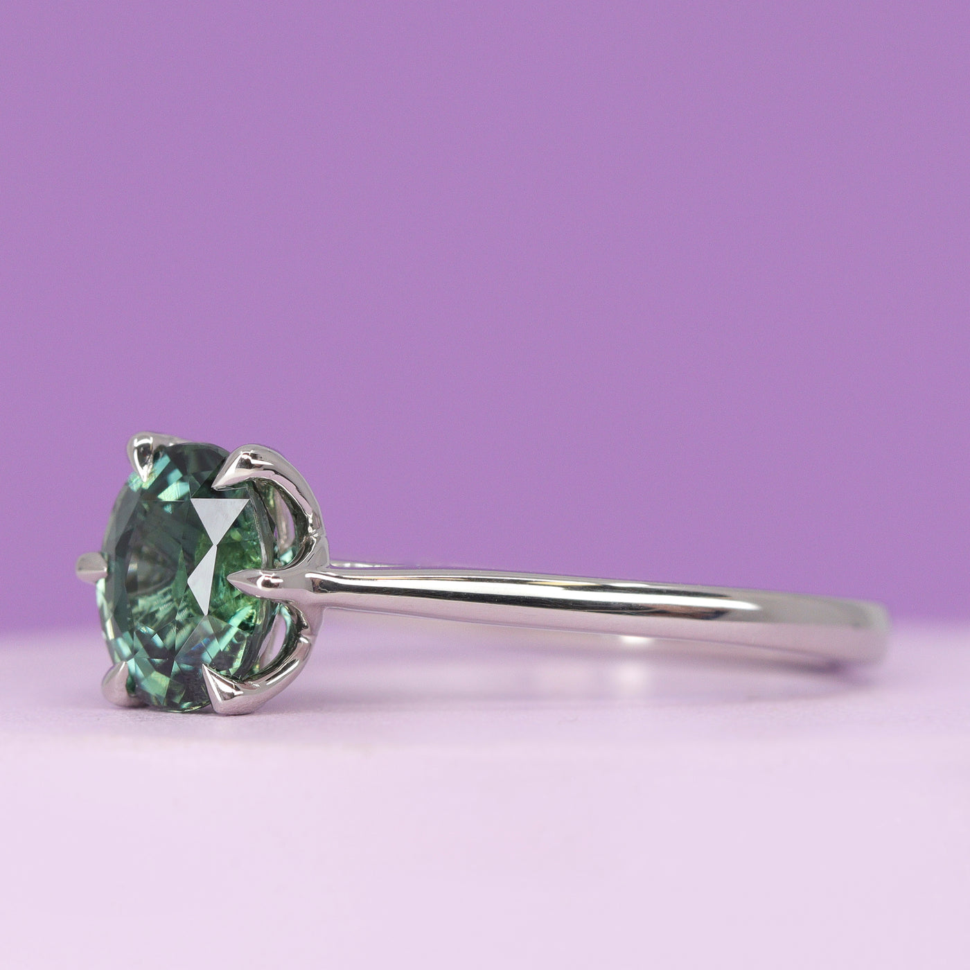 Raine - Oval Cut Teal Sapphire Solitaire Ring with Lotus Flower Inspired Setting - Made-To-Order