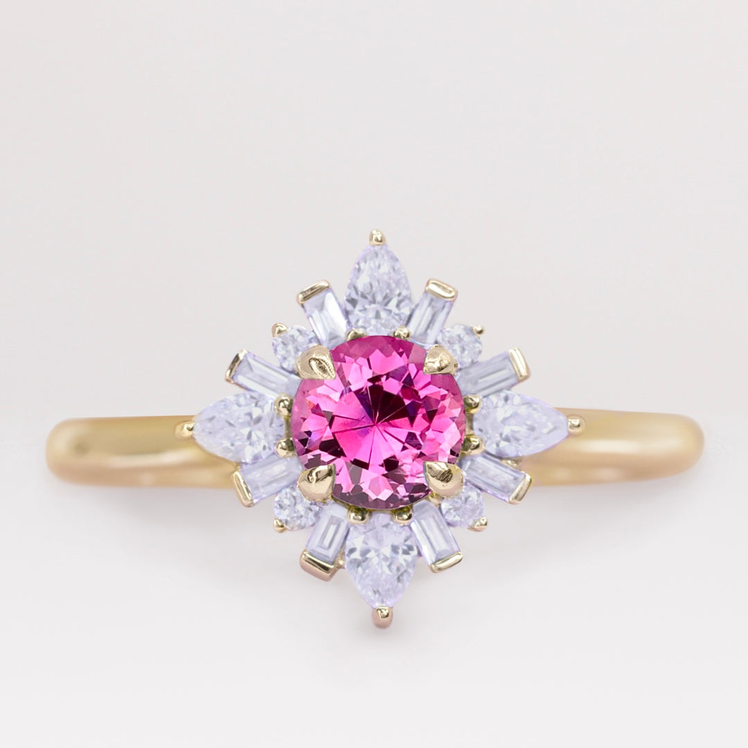 Unique pink sapphire and white diamond engagement ring in yellow gold