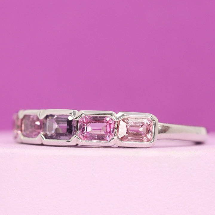 Primrose - Emerald Cut Pink Sapphire 5 Stone Half Rubover Eternity Style Ring in 9ct White Gold - Ready-to-Wear