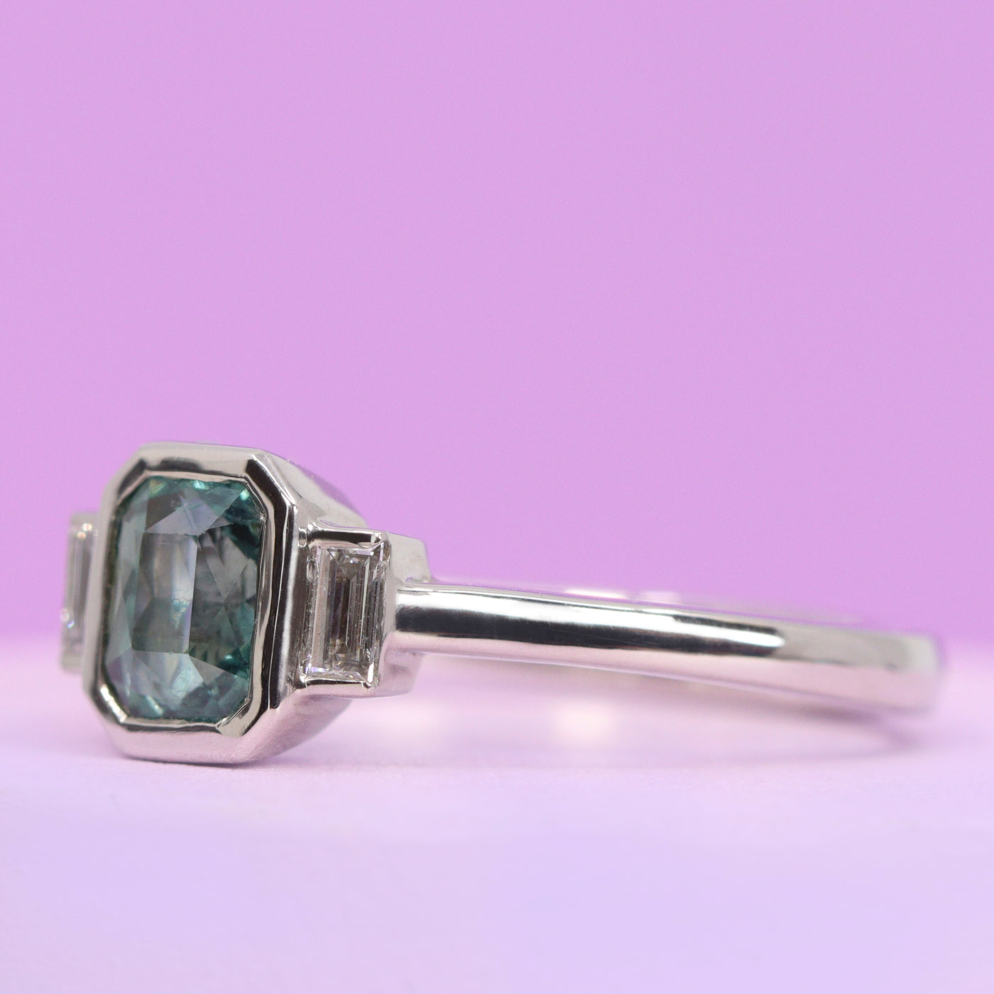 Phoebe - Radiant Cut Blue Teal Sapphire and Lab Grown Baguette Diamond Bezel Set Modern Art Deco Engagement Ring in Platinum - Ready-to-Wear