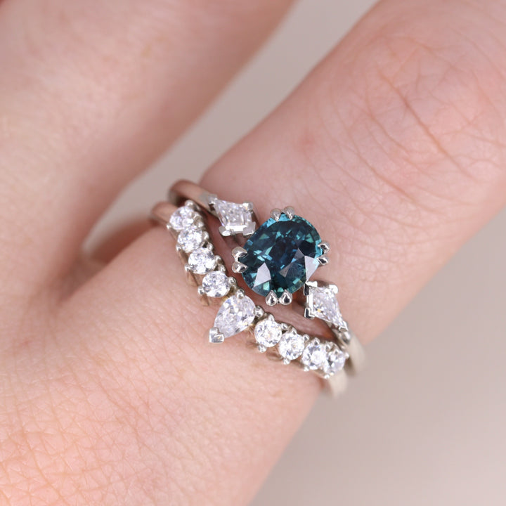 Oval cut teal sapphire white diamond engagement ring