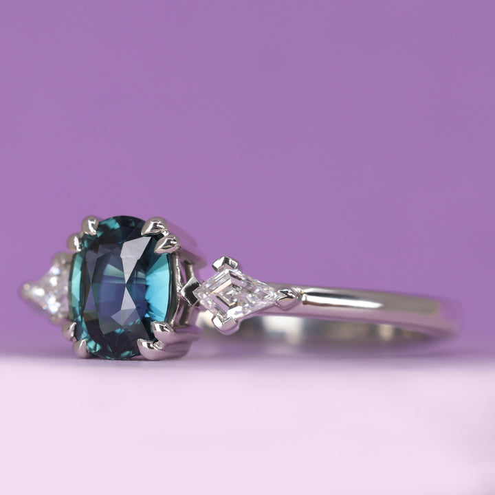 Dahlia - Oval Cut Teal Sapphire Trilogy Engagement Ring