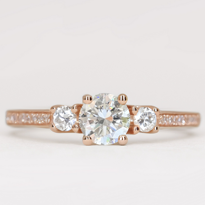 Round white diamond and white diamond pave  rose gold band engagement ring