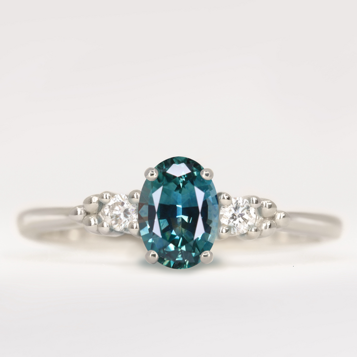 Natalia - Oval Cut Teal Sapphire Trilogy Engagement Ring