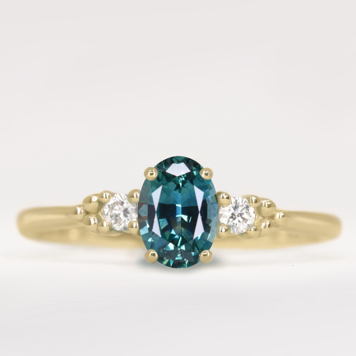 Natalia - Oval Cut Teal Sapphire Trilogy Engagement Ring